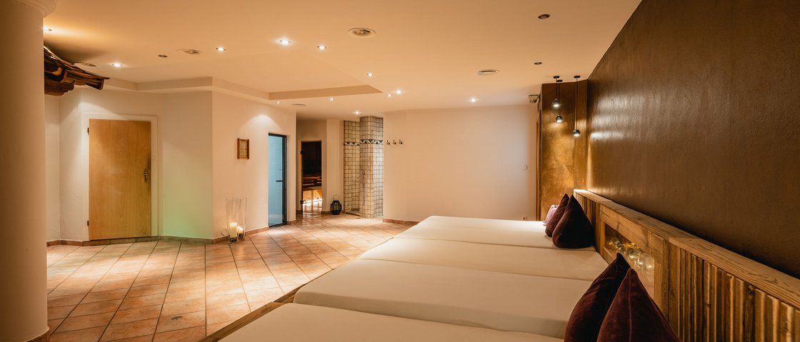 Your wellness hotel in Neustift im Stubaital awaits Calm wellness room with loungers, warm lighting, and modern design